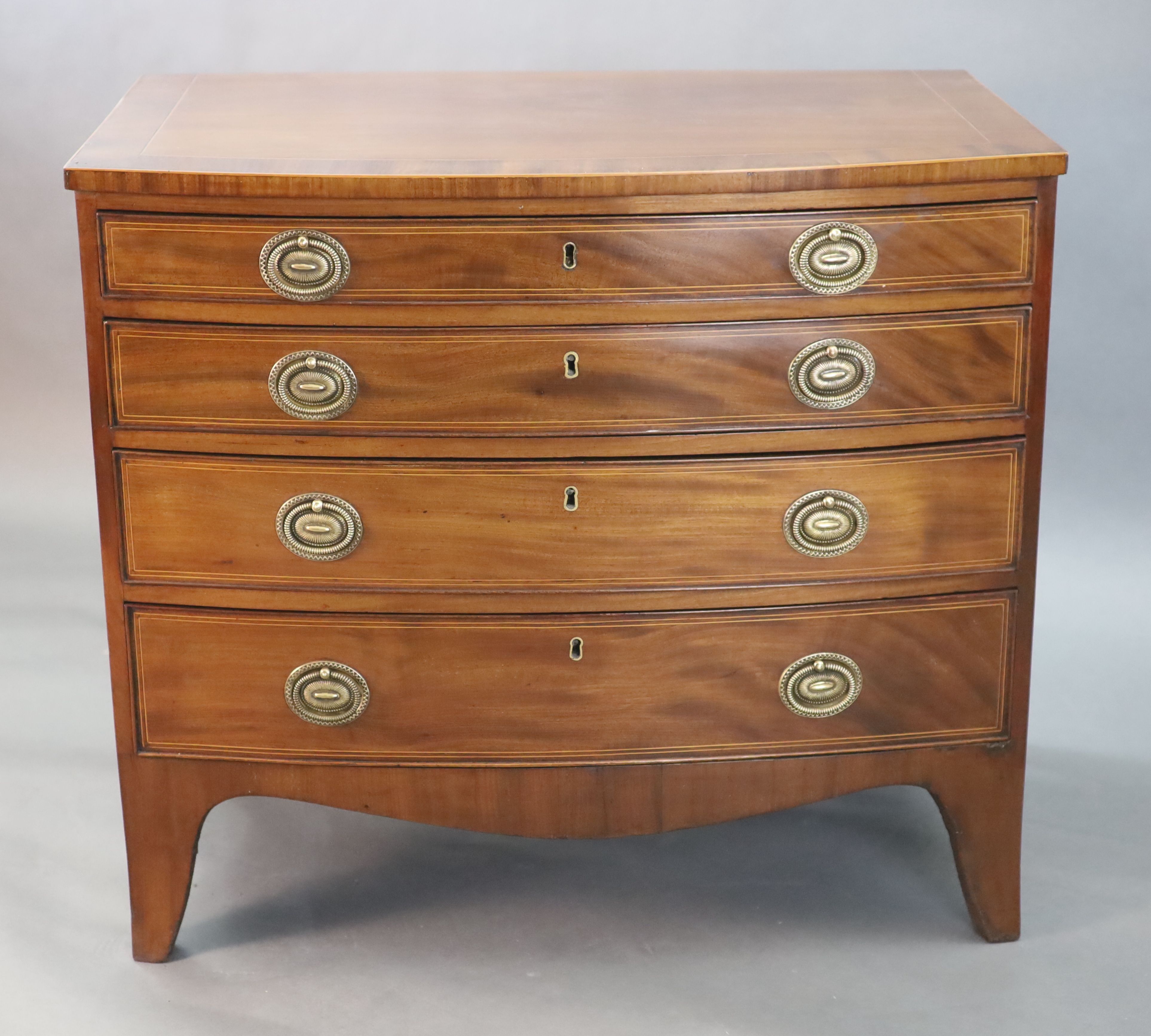 A Regency crossbanded mahogany bowfront chest, W.2ft 10in. D.1ft 10in. H.2ft 6in.
